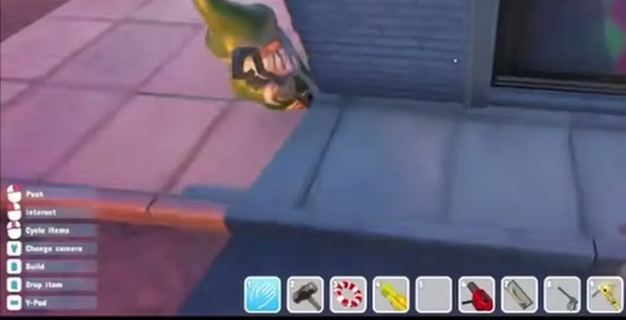 A small garden gnome with a green pointed hat perched on a ledge beside a window in the city