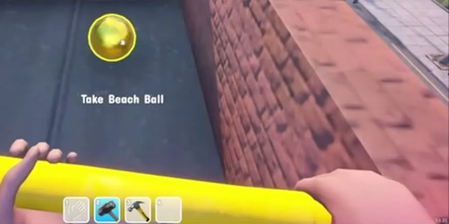 A golden beach ball on a flat rooftop with the prompt Take Beach Ball, seen while holding the golden sledgehammer